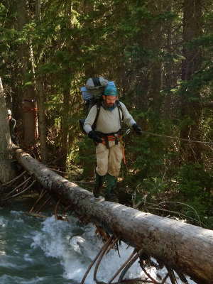 Ezra crossing a river on logs Ezra crossing a river on logs